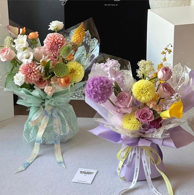 花の愛,人民の日,小さな蕾,セルロファン,蕾の縁,ウォーターバッグ,花の紙,花屋さん,人気の花束の包装材料